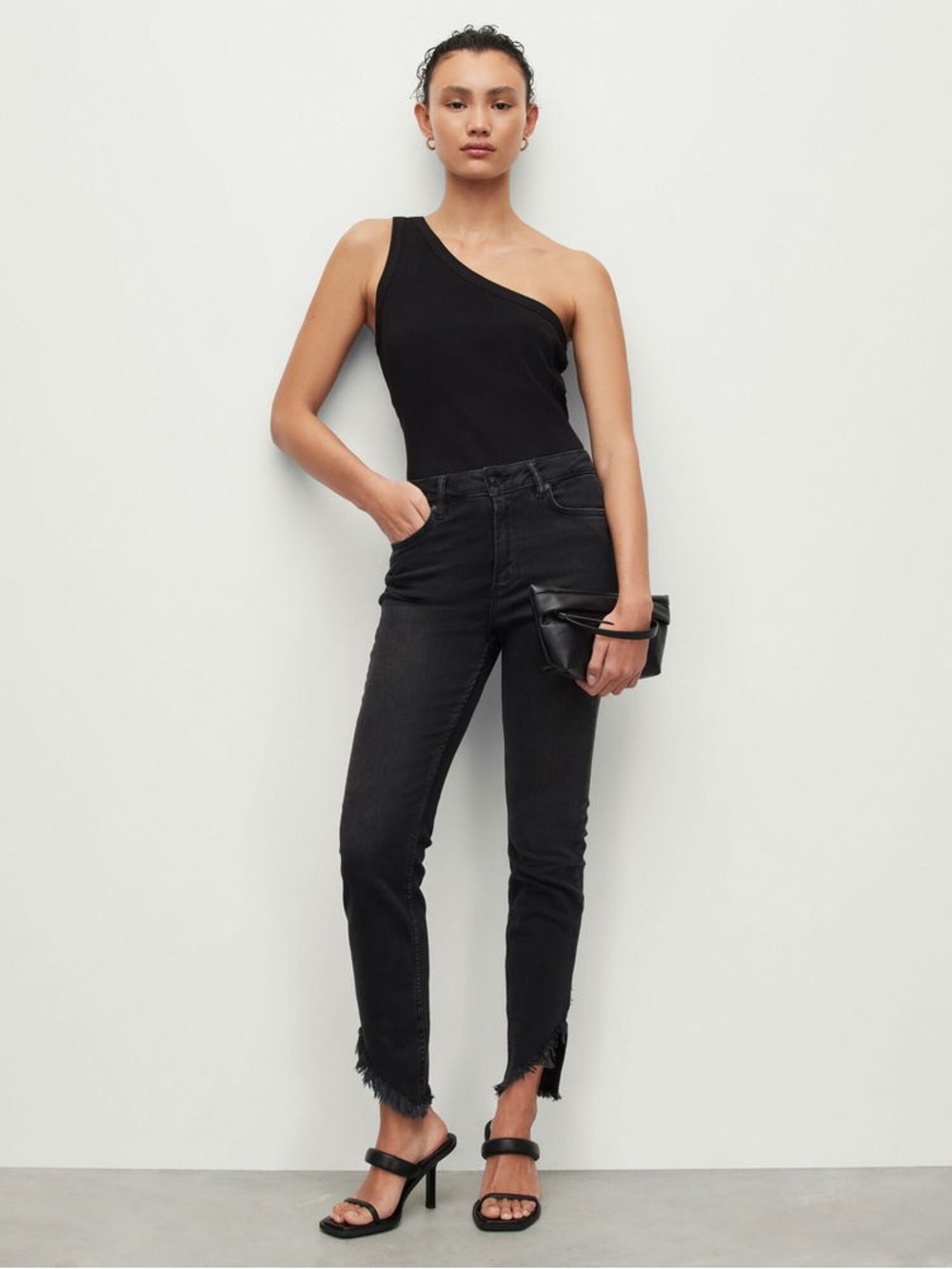 Dax Frayed Asymmetric Hem Skinny Jeans In Washed Black